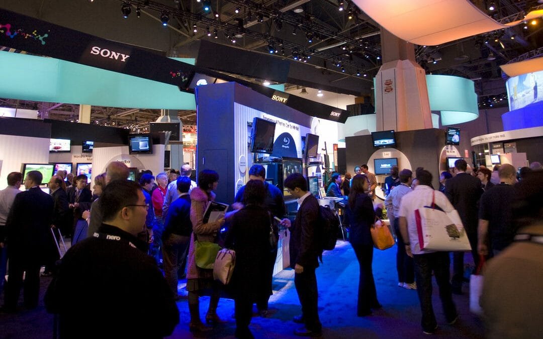 connecting in front of a convention display